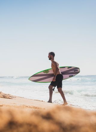 Man enjoying the surf at North Narrabeen Beach, North Narrabeen