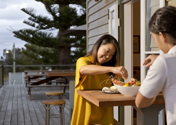  Couple enjoying a fresh seafood at the Tathra Hotel