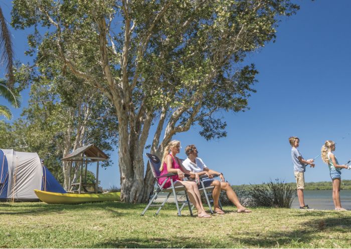 A family fishing at the Big4 Koala Shores holiday park, Port Stephens
