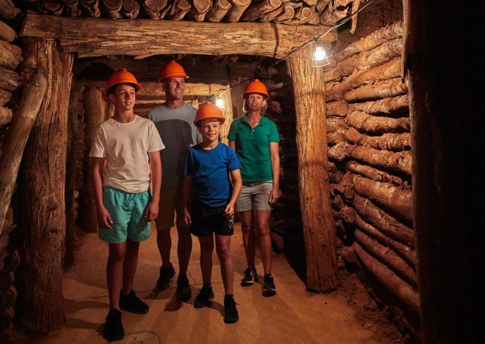 Family exploring the cave systems at Wellington Caves and Phosphate Mines, Wellington