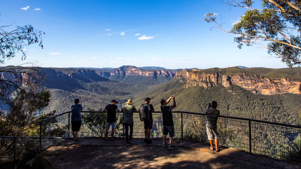 Tourists enjoying the views across the Grose Valley at Evans Lookout in Blackheath, Katoomba Area