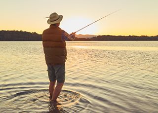 Man fishing at Tuross Head, Eurobodalla NSW
