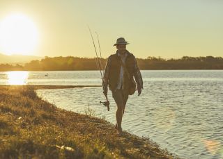 Man fishing in Tuross River in Tuross Heads, South Coast