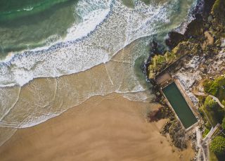 Scenic aerial overlooking Yamba Main Beach and Yamba Ocean Pool, North Coast