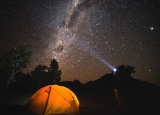 The night sky filled with bright stars over the dark sky park in the Warrumbungles