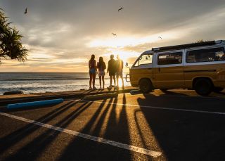 People with campervan at Main Beach, Byron Bay