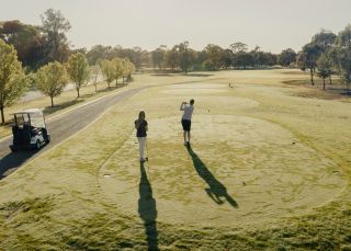 Couple enjoying a round of golf at Rich River Golf Club & Resort, Moama