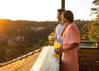 Couple looking at the view from Echoes Boutique Hotel and Restaurant, Blue Mountains