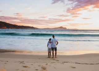 Father and son enjoying a morning walk, Number One Beach, Seal Rocks