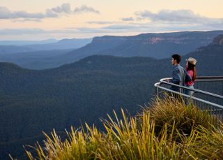 Couple visits and looks at view, Scenic World, Katoomba