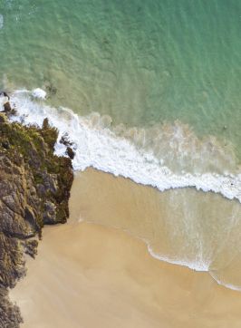 Scenic aerial views overlooking Horseshoe Bay Beach in South West Rocks, Coffs Harbour, North Coast