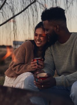 Couple enjoying campfire, Wilga Station, Evans Plains