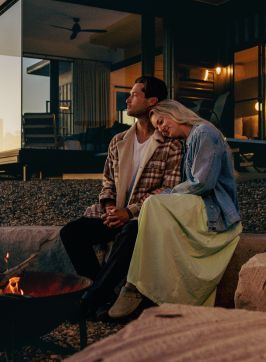 A couple getting cosy in front of a fire pit at Sierra Escape, Mudgee - Credit: Sierra Escape