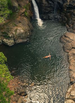 Aerial of woman in water, Whian Whian Falls, Dunoon