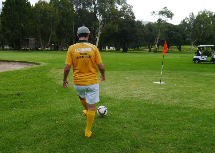 Man kicking ball at Jamberoo FootGolf, on the NSW South Coast