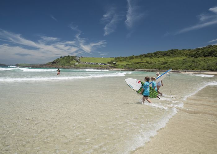 Children heading out for a surf, Killalea State Park, Shell Cove - Credit: Dee Kramer Photography