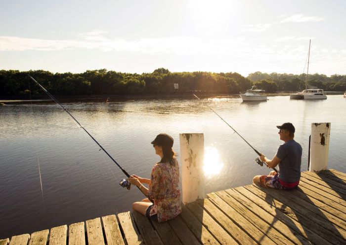 Couple fishing in Huskisson, on the shores of the spectacular Jervis Bay Marine Park in the Shoalhaven region.