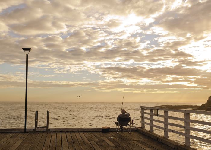 Man enjoying a relaxing day fishing, Tathra Wharf, Tathra
