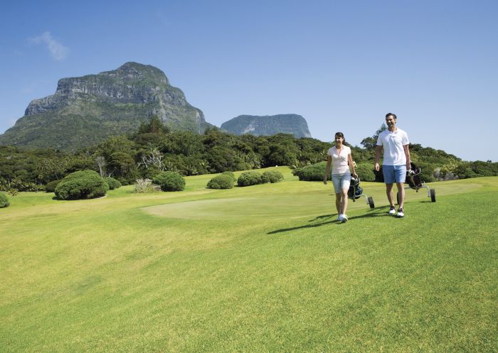 Couple enjoying a round of golf at Lord Howe Island Golf Course.