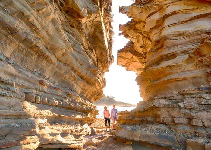 Couple enjoying a scenic morning walk around Wasps Head in Murramarang National Park, South coast
