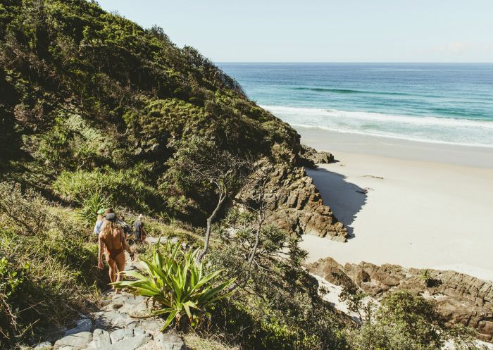 Friends walking to beach, Whites Beach, Byron Bay