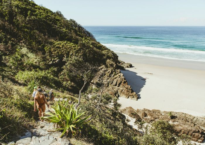 Friends walking to beach, Whites Beach, Byron Bay