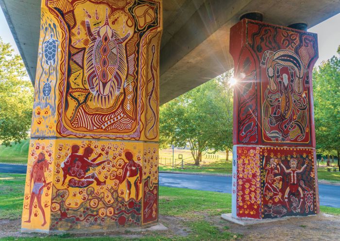 Aboriginal murals painted by indigenous artist Kym Freeman on the Cowra Bridge Pylons located beneath the Lachlan River Bridge in Cowra, Country NSW