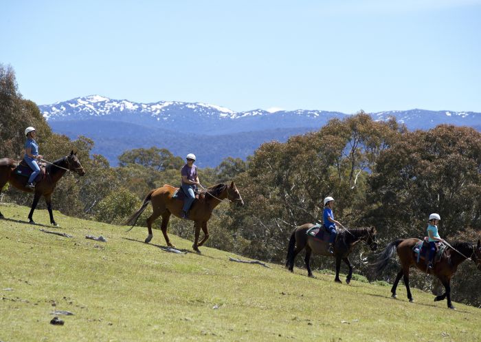 Family enjoying a scenic horse ride around the Snowy Wilderness property in Ingebirah, Snowy Mountains.