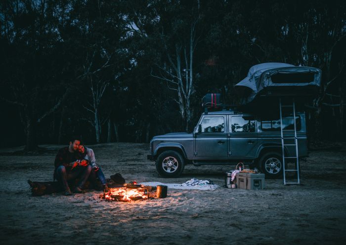 A couple enjoying a camping weekend away on the banks of the Murray River at Ulupna Island - The Murray - Country NSW