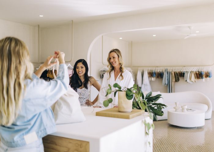 Women enjoying a shopping experience at Zulu and Zephyr clothing store in Byron Bay.