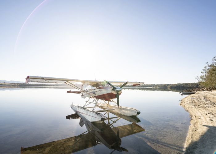 Aircraft docked on the banks of Coila Lake, Tuross Head