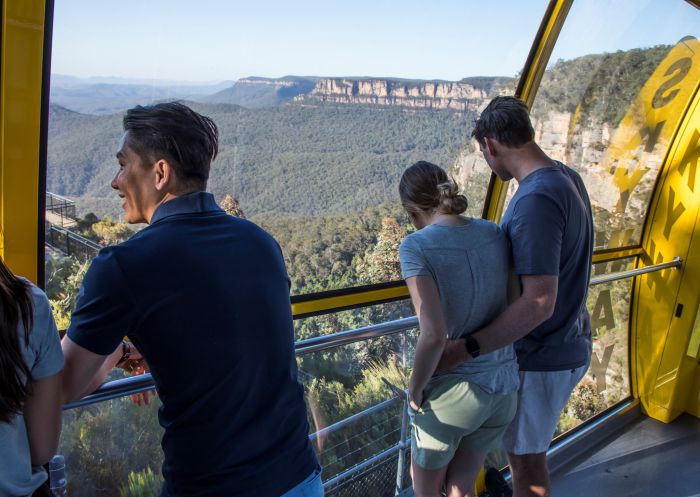 Visitors enjoying a ride over the Jamison Valley in the Scenic Skyway cable car in Katoomba