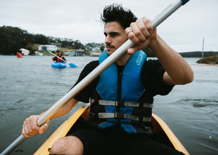 Man kayaking along Tuross Lake, Tuross Head