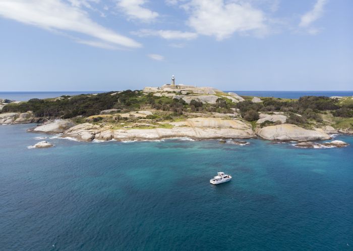 Montague Island Adventures tour boat along the shores of Montague Island Nature Reserve, Narooma.