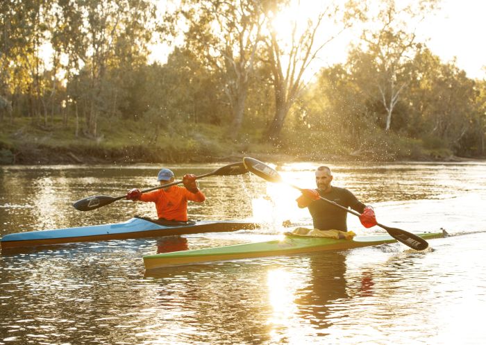 Friends enjoying a morning kayak along the Murray River in Albury, The Murray