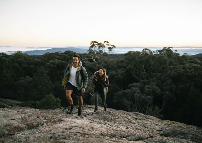 Couple enjoying a scenic walk through Woomargama National Park, Wantagong, The Murray