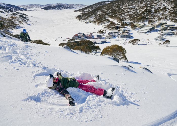 Girl enjoying a fun day in the snow at Charlotte Pass in the Snowy Mountains