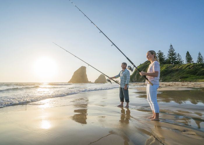 Father and daughter enjoying a morning of fishing at Glasshouse Rocks in Narooma, South Coast