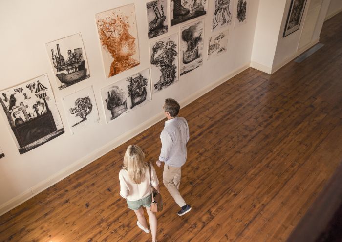Couple enjoying a visit to the Broken Hill Regional Art Gallery in Broken Hill, Outback NSW