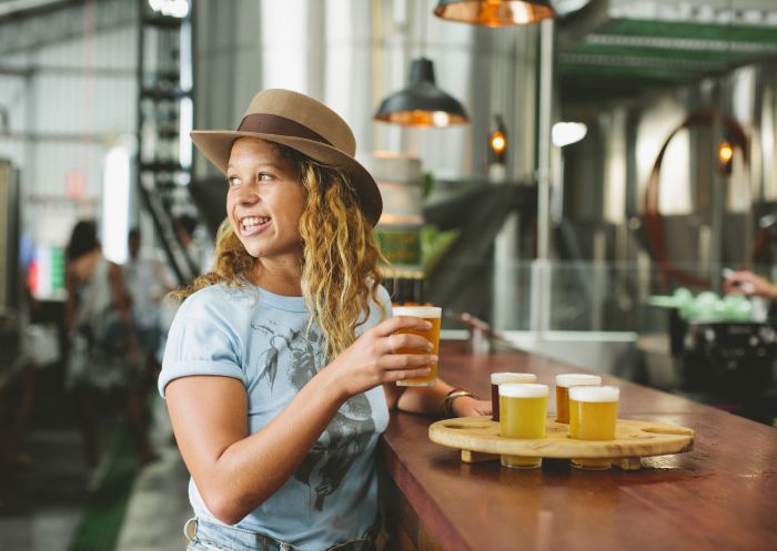 Woman beer tasting at Stone & Wood Brewing Company, Byron Bay