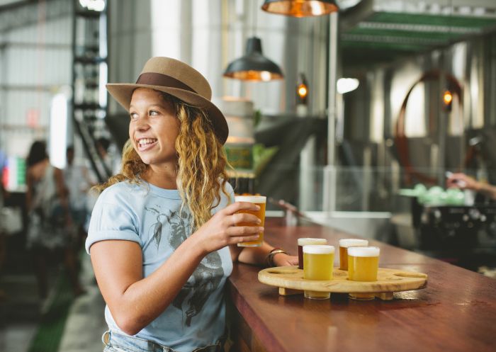 Woman beer tasting at Stone & Wood Brewing Company, Byron Bay