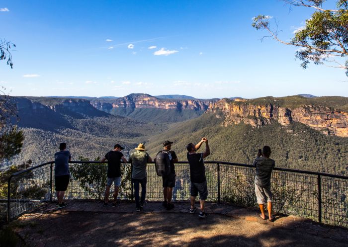 Tourists enjoying the views across the Grose Valley at Evans Lookout in Blackheath, Blue Mountains