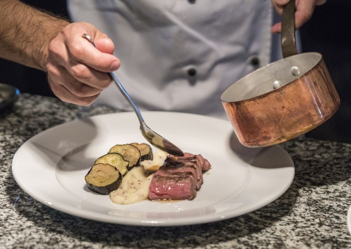 Federico Tidu of Limone Dining, Griffith plates up a dish for service