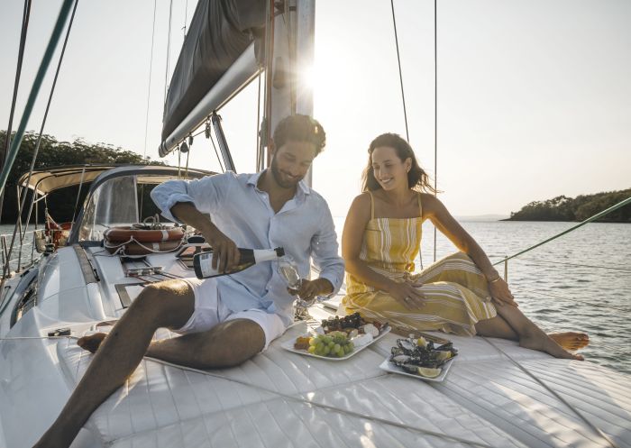 Couple enjoying a sailing experience in Fame Cove, Port Stephens