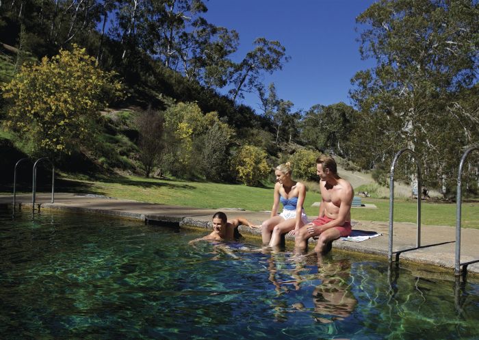 Friends enjoying a swim at the thermal pools near Yarrangobilly Caves in Kosciuszko National Park, Snowy Mountains