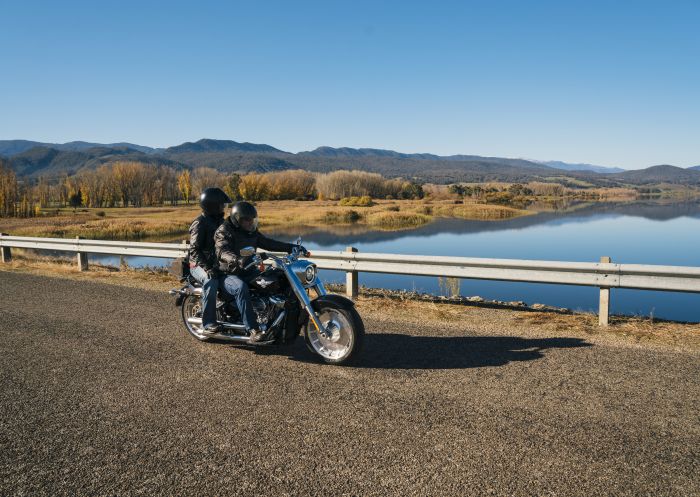 Motorcyclist stopping for a scenic break besides Khancoban Pondage in the Snowy Mountains