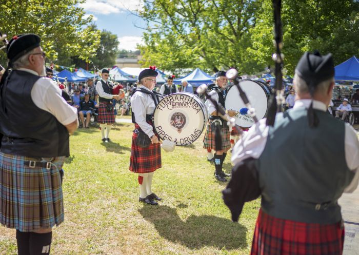 Members of the Tumbarumba Pipes and Drums ensemble playing at the 2018 Tumbafest in Tumbarumba, Snowy Mountains.