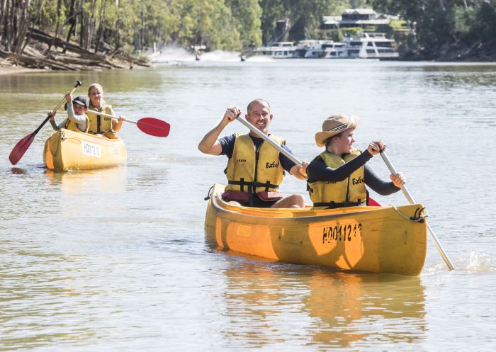 family enjoying a day of canoeing on the Murray River, Moama