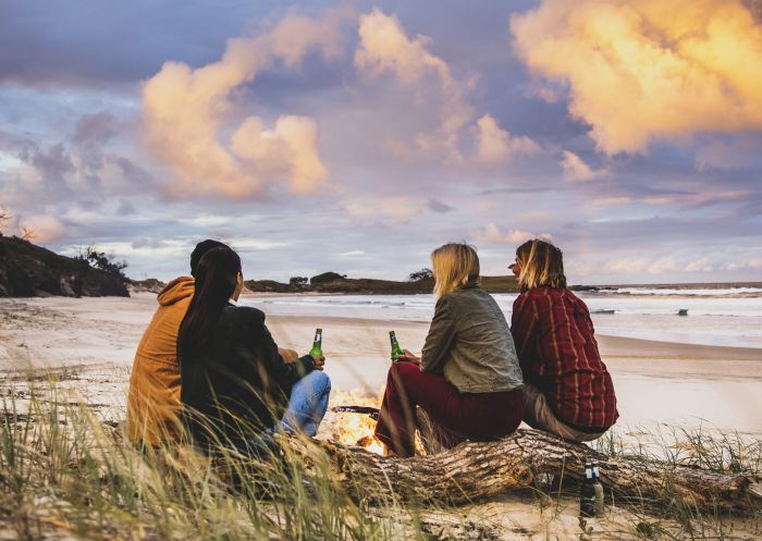 Article-Friends enjoying a bonfire on Angourie Back Beach in Angourie, North Coast 