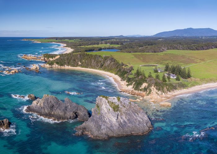 Aerial overlooking Glasshouse Rocks, Narooma with views across to Mount Dromedary